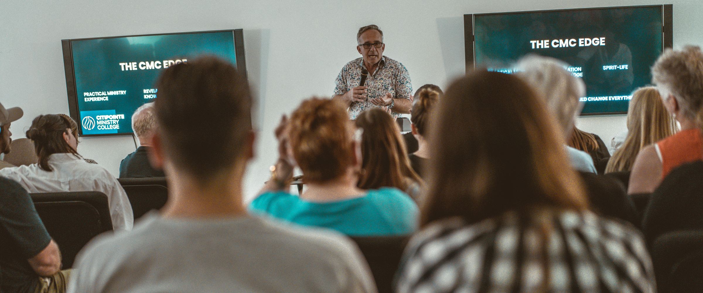 Andrew Staggs speaking to a seated group at Citipointe Ministry College